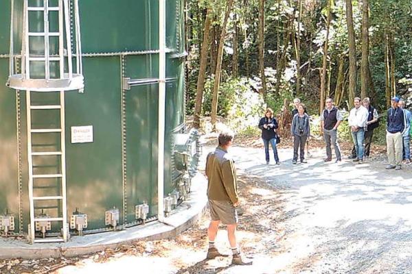  A multi-agency tour at Westminster Woods camp on Dutch Bill Creek where John Green of Gold Ridge RCD is describing how two new tanks (total capacity of 175,000 gallons) will store winter water as part of an integrated instream flow enhancement effort for coho salmon recovery while also improving summer irrigation for the camp’s playing fields. By Brock Dolman, Occidental Arts and Ecology Center